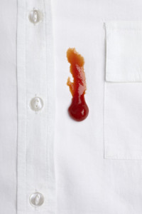 close up of ketchup stain on white shirt